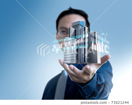 Businessman show graph value price of real estate building for investment. Businessman show graph value price of real estate building for investment. 73821244