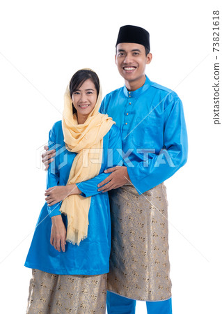 asian couple during hari raya eid mubarak 73821618