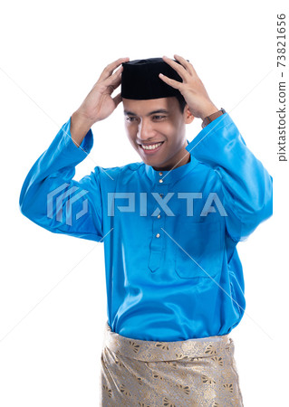 man put his clothes for eid mubarak celebration 73821656