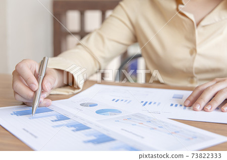 Financial businesswomen analyze the graph of the company's performance to create profits and growth, Market research reports and income statistics, Financial and Accounting concept. Financial businesswomen analyze the graph of the company's performance to create profits and growth, Market research reports and income statistics, Financial and Accounting concept. 73822333