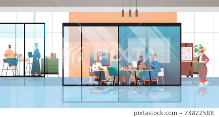 businesspeople working and talking together in coworking center business meeting teamwork concept businesspeople working and talking together in coworking center business meeting teamwork concept 73822588