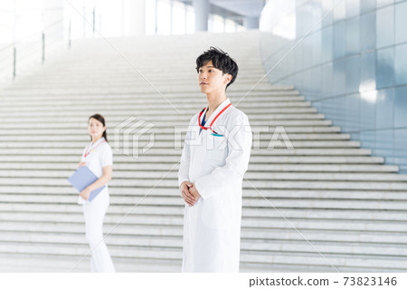 Young doctor working in a hospital Young doctor working in a hospital 73823146