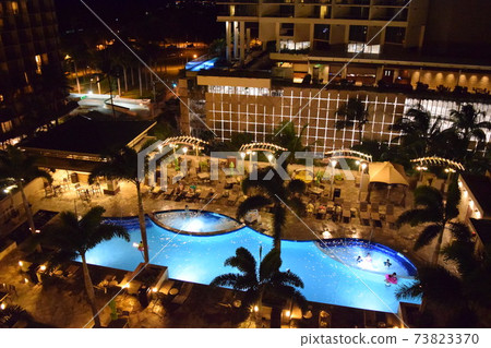 Overlooking the Hawaiian night pool Overlooking the Hawaiian night pool 73823370