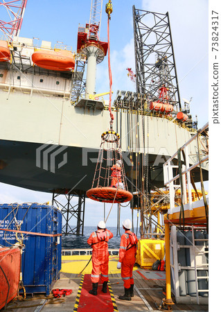 Offshore construction platform for production oil and gas. Oil and gas industry and hard work. Production platform and operation process by manual and auto function from control room. Offshore construction platform for production oil and gas. Oil and gas industry and hard work. Production platform and operation process by manual and auto function from control room. 73824317
