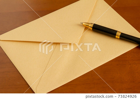 Image of envelope and ballpoint pen letter 73824926
