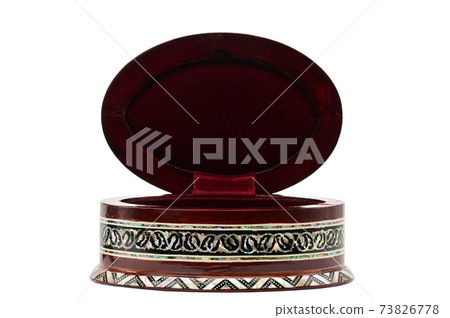 Wooden box with ornaments for jewelry and bijoux on a white background 73826778