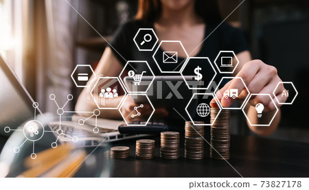 Businesswoman hand using laptop, tablet and smartphone  in office. Digital marketing media mobile app in virtual icon screen. 73827178