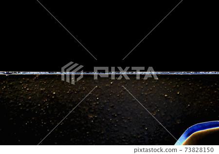 Macrophotography. Abstract background of horizontal stripes of dark color. Rough and smooth Macrophotography. Abstract background of horizontal stripes of dark color. Rough and smooth 73828150