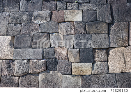 The stone wall of the former Edo Castle in the Imperial Palace 73829180
