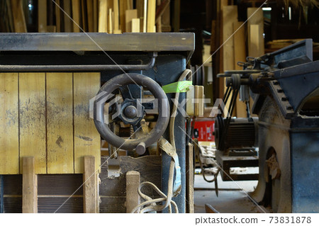 Old woodworking machine 73831878