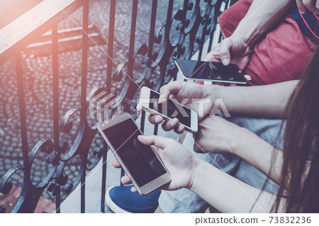 Close up of men hands holding touching mobile phone with blank copy space for your text message in cafe Close up of men hands holding touching mobile phone with blank copy space for your text message in cafe 73832236