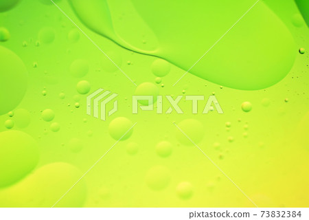 Green and yellow abstract background picture made with oil, water and soap 73832384