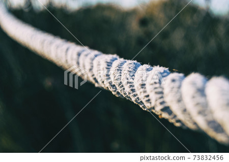 jute rope wound on a pole 73832456