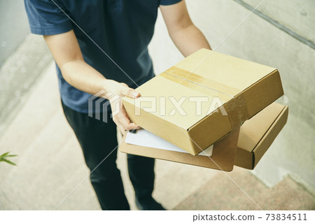 Delivery courier cardboard uniform stairs Delivery courier cardboard uniform stairs 73834511