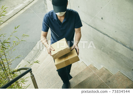 Delivery courier cardboard uniform stairs Delivery courier cardboard uniform stairs 73834544