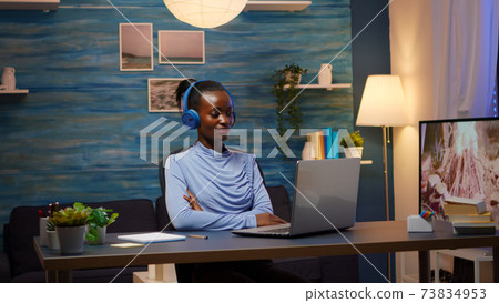 African american with wireless headphones listening online courses 73834953