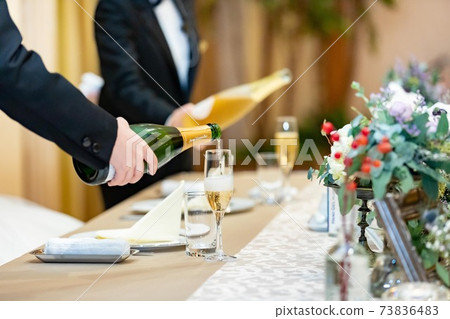 Wedding reception, pouring champagne 73836483