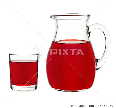 red currant drink in a glass and decanter 73838769