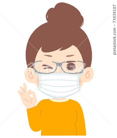 Woman taking measures against hay fever with mask and goggles glasses-wink, OK sign 73839187