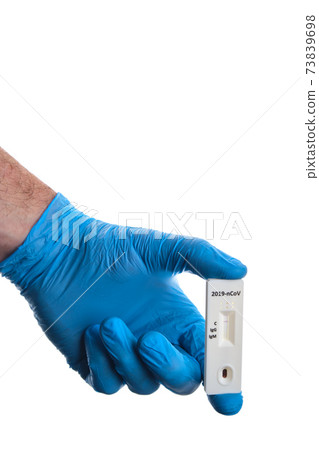 Doctor shows rapid laboratory COVID-19 test for detection of IgM and IgG antibodies to Novel Coronavirus, worldwide pandemics concept. Doctor shows rapid laboratory COVID-19 test for detection of IgM and IgG antibodies to Novel Coronavirus, worldwide pandemics concept. 73839698