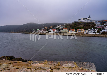 Ocean with mountains in fog in the background. Picture from Molle, Scania, Sweden 73840064