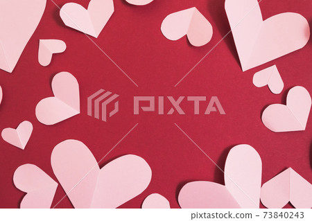Valentine's day background. Pink hearts laid out in the form of a frame on a burgundy background. Valentine's day concept. Layout for postcards and congratulations. Flat lay, top view, copy space Valentine's day background. Pink hearts laid out in the form of a frame on a burgundy background. Valentine's day concept. Layout for postcards and congratulations. Flat lay, top view, copy space 73840243