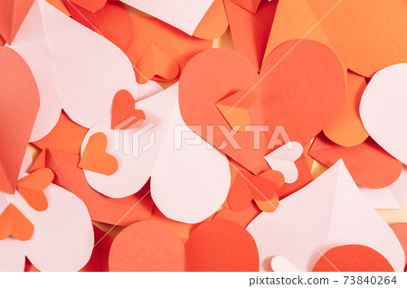 Valentine's day background. Pink, red, burgundy hearts of different sizes laid out randomly. Valentine's day concept. Layout for postcards and congratulations. Flat lay, top view, copy space Valentine's day background. Pink, red, burgundy hearts of different sizes laid out randomly. Valentine's day concept. Layout for postcards and congratulations. Flat lay, top view, copy space 73840264