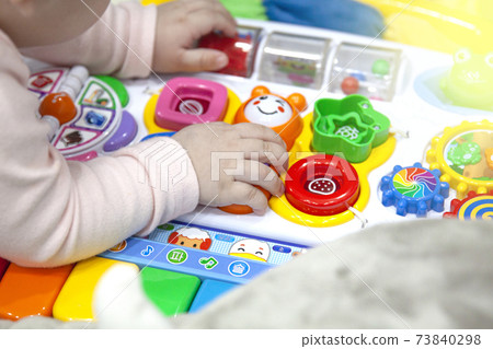 Child's hand playing with toys Child's hand playing with toys 73840298