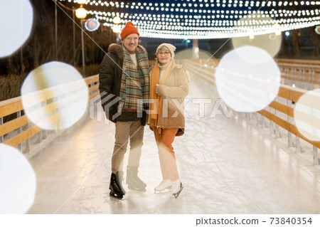 Christmas holidays on ice rink 73840354