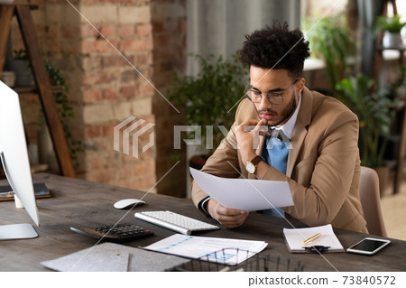 Businessman working with documents 73840572