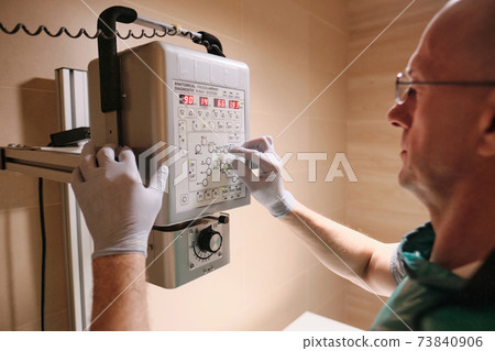 Doctor working with medical equipment Doctor working with medical equipment 73840906