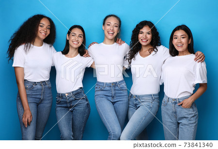 Diverse Females Group Smiling Posing In Studio On Blue Background 73841340
