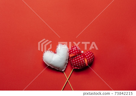 Red textile hearts on wooden sticks for Valentines day background Red textile hearts on wooden sticks for Valentines day background 73842215