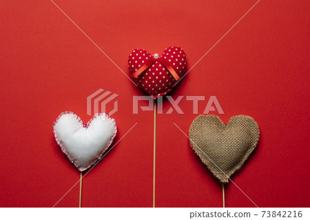 Red textile hearts on wooden sticks for Valentines day background Red textile hearts on wooden sticks for Valentines day background 73842216
