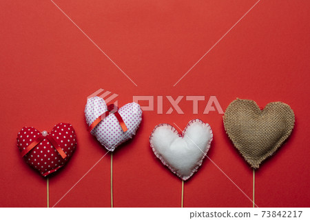 Red textile hearts on wooden sticks for Valentines day background Red textile hearts on wooden sticks for Valentines day background 73842217