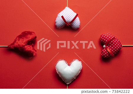 Red textile hearts on wooden sticks for Valentines day background Red textile hearts on wooden sticks for Valentines day background 73842222
