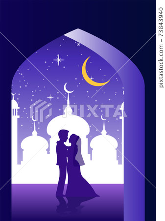 Bride and groom hug together in moque 73843940