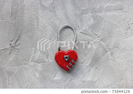 Red padlock or love lock on gray background, heart shaped Red padlock or love lock on gray background, heart shaped 73844129