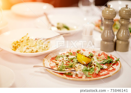 half-empty salad plates on the table. Catering half-empty salad plates on the table. Catering 73846141