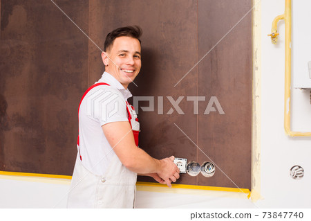 The electrician is happy to work at the new object 73847740