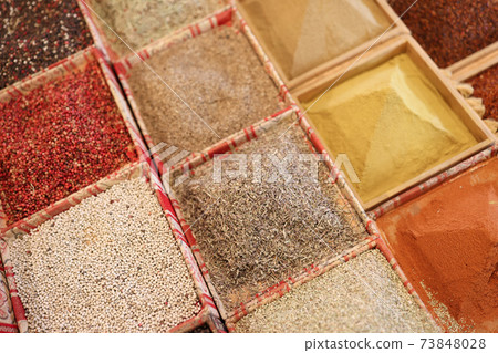 Condiments and spices in store trays closeup Condiments and spices in store trays closeup 73848028