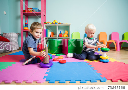 the little kids learning different skills in the kindergarten the little kids learning different skills in the kindergarten 73848166