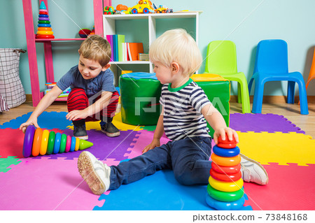 the preschoolers are playing with colorful educational toys the preschoolers are playing with colorful educational toys 73848168