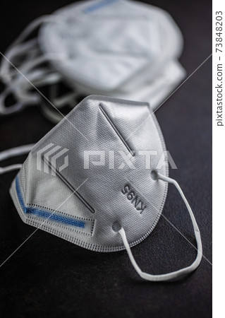 KN95 face mask. FFP2 mask as covid-19 protection. Coronavirus mask KN95 face mask. FFP2 mask as covid-19 protection. Coronavirus mask 73848203