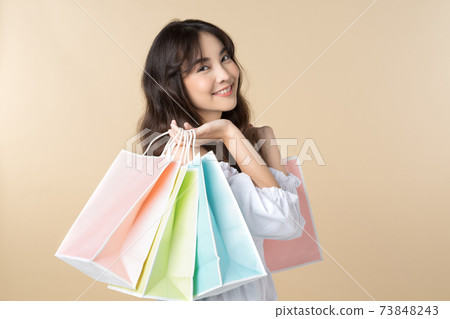 Young Asian woman holding shopping bag 73848243