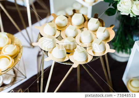 Delicious wedding reception candy bar dessert table 73848513