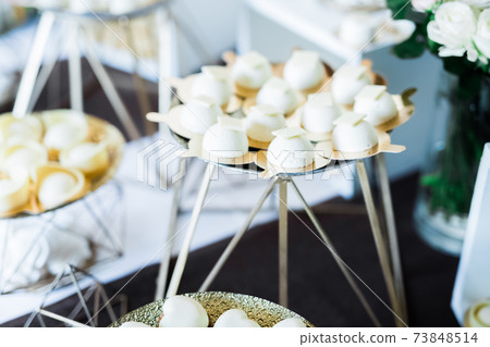 Delicious wedding reception candy bar dessert table Delicious wedding reception candy bar dessert table 73848514