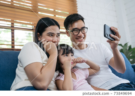 family taking a selfie 73849694
