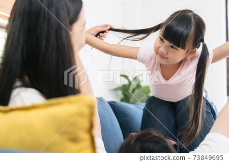 Happy little girl daughter playing with father 73849695