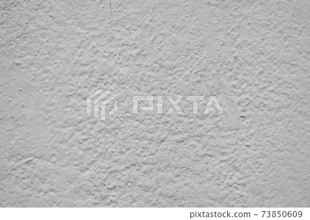 Light plastered wall with defects texture close up 73850609